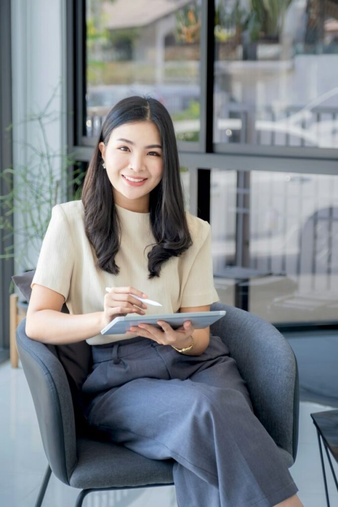 Business woman bookkeeper's hand use tablets doing account for paying taxes in the working office